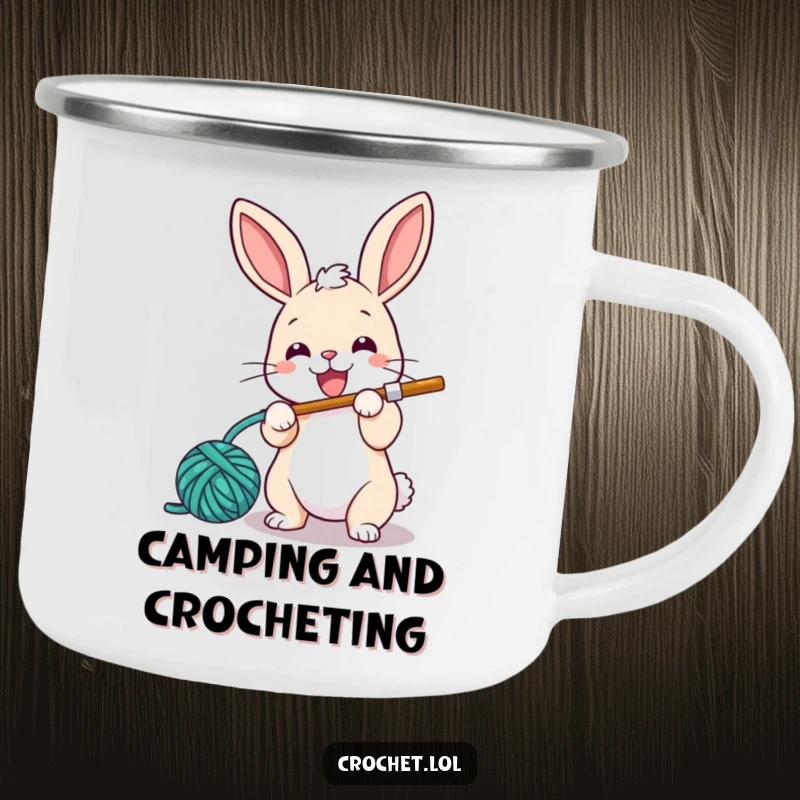 Funny camping mug with a small, energetic bunny character happily looping yarn with a crochet hook, ideal for outdoor enjoyment.