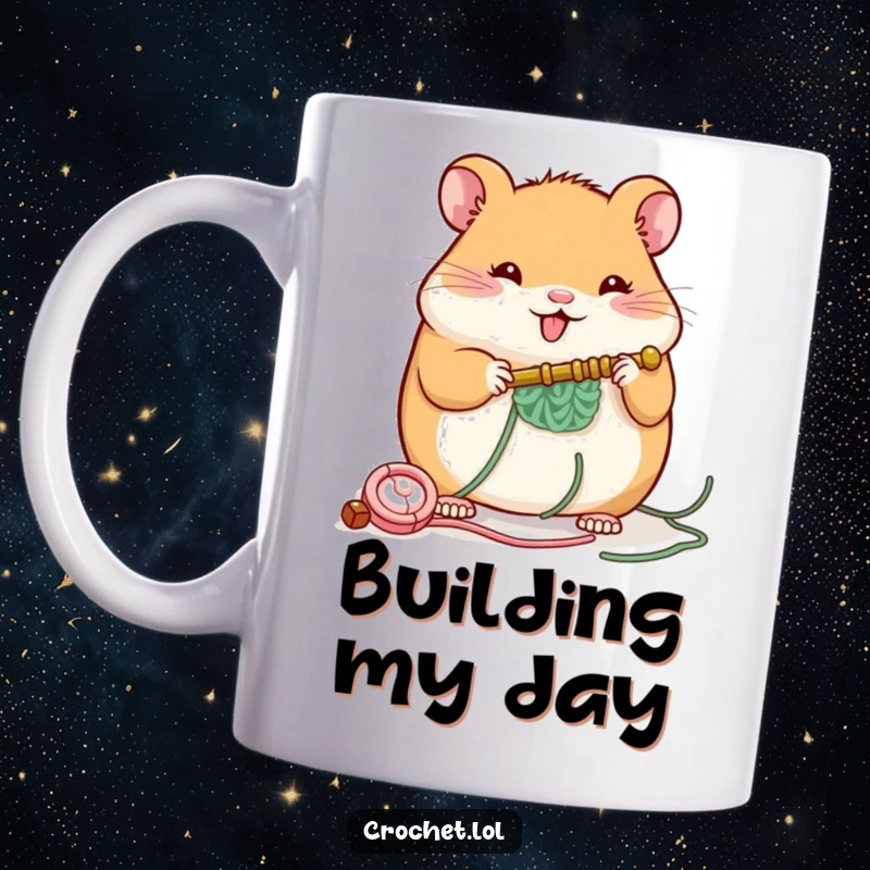 Funny mug showing a plump, cheerful hamster happily using a crochet hook to build a small structure, radiating industrious joy.