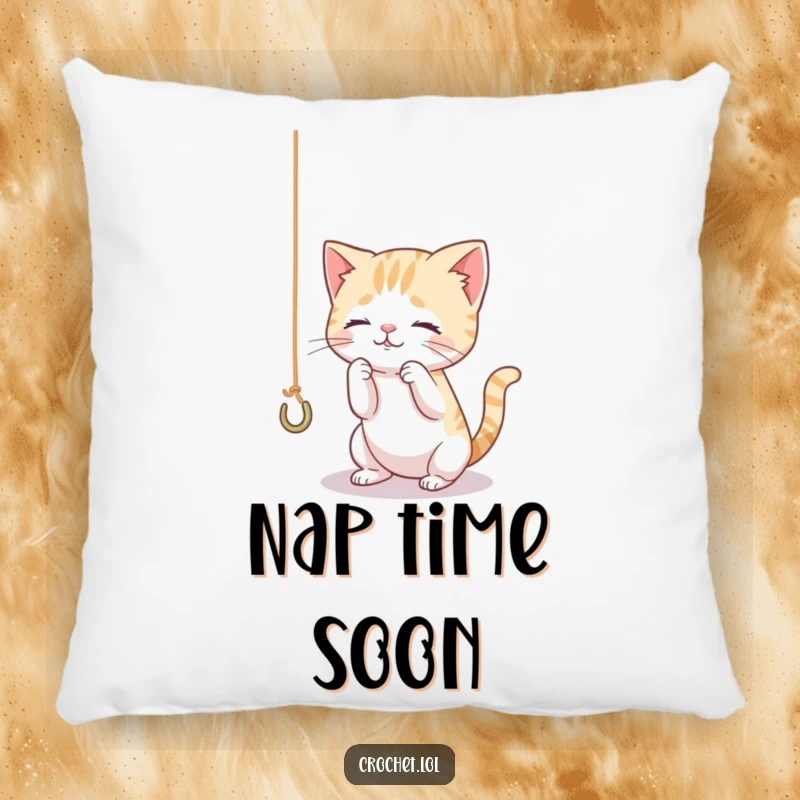 Funny pillow with a tiny, curious cat character playing with a dangling thread and hook, providing comfort and amusement.