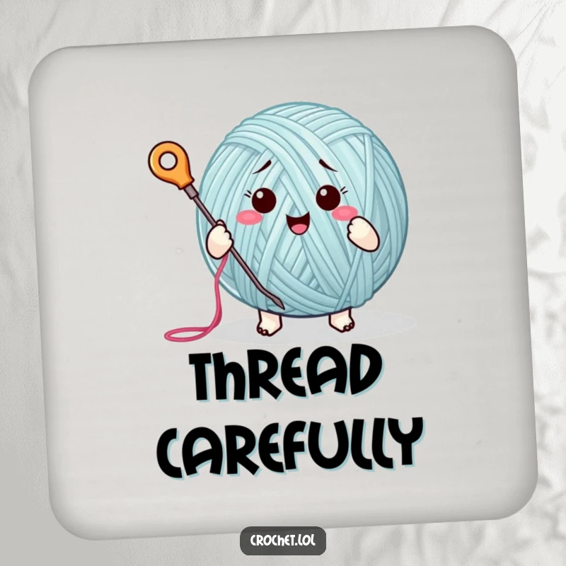 Funny drink coaster featuring a cute yarn ball character enthusiastically stitching, ideal for protecting surfaces with a touch of humor.