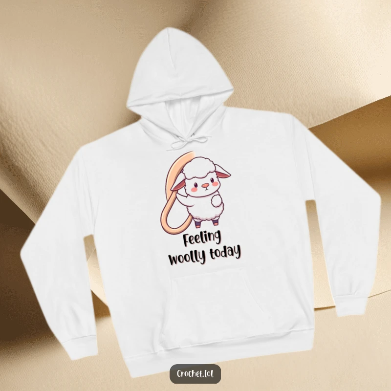 Funny hoodie featuring a fluffy sheep with a giant hook, diligently crafting a large loop, designed for ultimate comfort and humor.