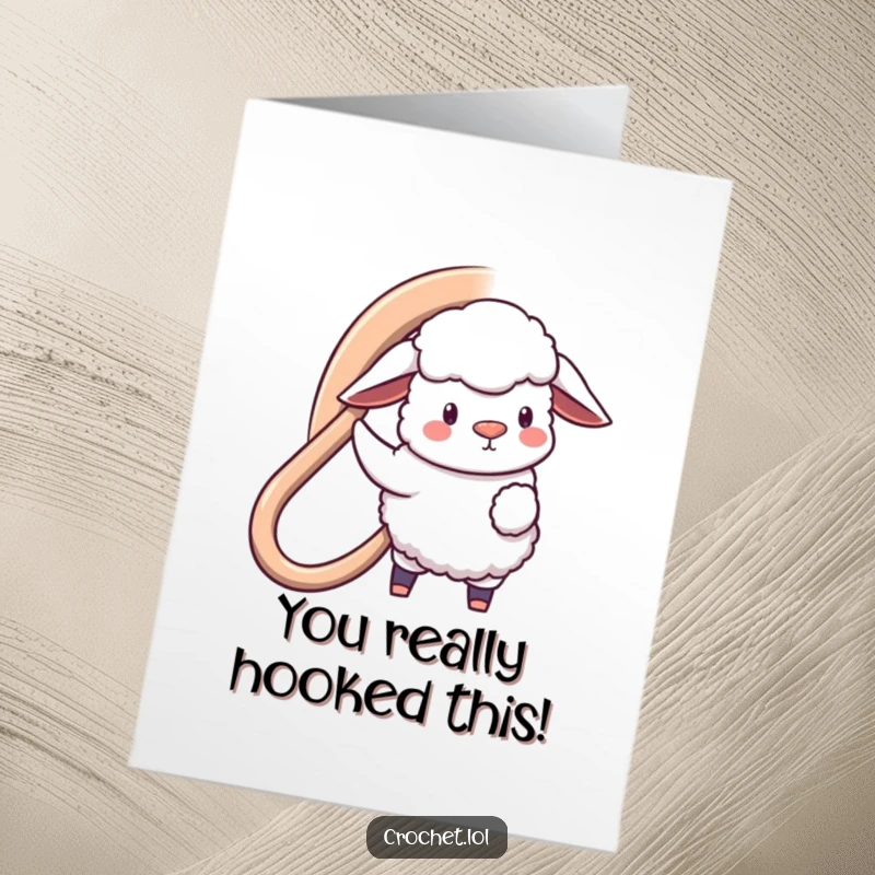 Funny Free Printable Congrats Card: A happy sheep using a giant crochet hook to loop a congratulatory message, full of humor.