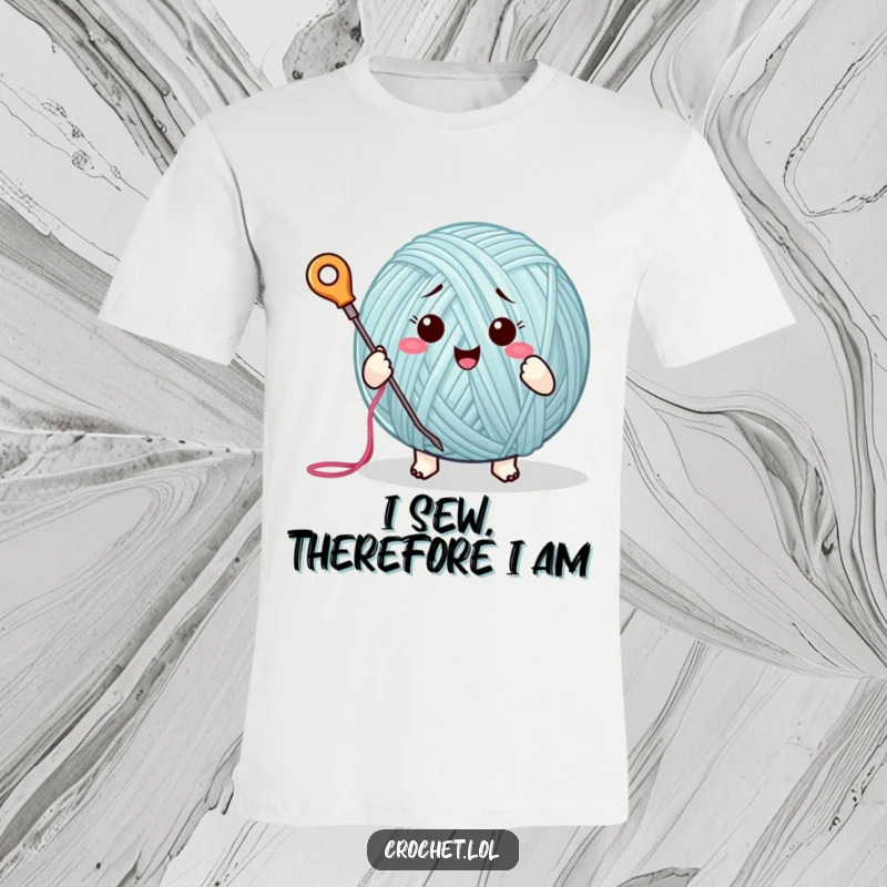 Funny t-shirt depicting a cute yarn ball character joyfully stitching with a needle and thread, perfect for craft lovers.