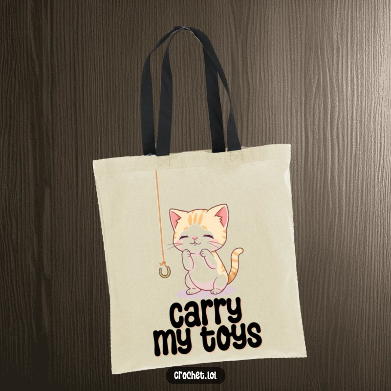 Funny tote bag featuring a tiny, curious cat playing with a dangling thread and hook, ideal for carrying cat toys or craft supplies.